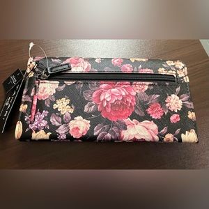 Floral wallet with identity protection lining. Never used